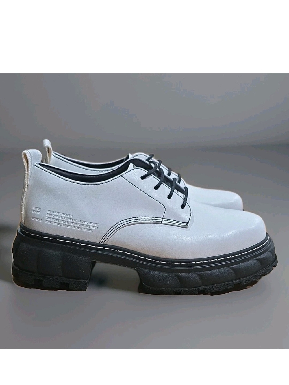 Women’s White Lace-Up Moccasin with Black Lug Sole